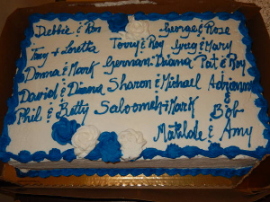 The couples all cut into a huge wedding cake decorated with each of their names.